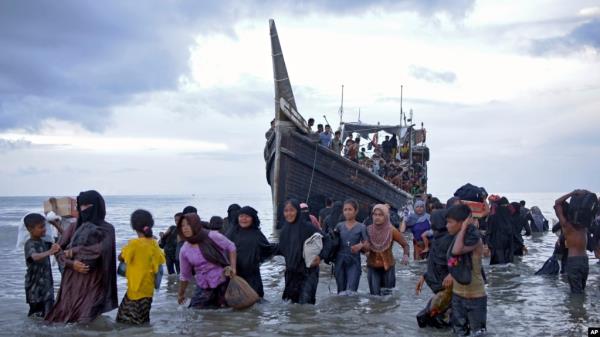 Rohingya Muslims disembark from their boat in Ulee Madon, North Aceh, Indonesia, Nov. 16, 2023. The U.N. refugee agency, Dec. 4, 2023, sounded the alarm for hundreds of Rohingya Muslims believed to be aboard two boats reported to be out of supplies and adrift on the Andaman Sea.