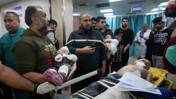 Palestinian children wounded in the Israeli bombardment of the Gaza Strip are brought to the hospital in Deir al Balah, Gaza Strip, Dec. 11, 2023. 