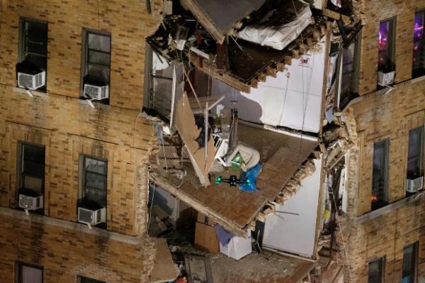 An FDNY drone (foreground) is seen searching for victims after a partial building collapse on W. Burnside Avenue and Phelan Place in the Bronx on Dec. 11, 2023.