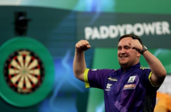 LONDON, ENGLAND - DECEMBER 20: Luke Littler celebrates during his round 1 match against Christian Kist on day 6 of the 2023/24 Paddy Power World Darts Champio<em></em>nship at Alexandra Palace on December 20, 2023 in London, England. (Photo by Tom Dulat/Getty Images)