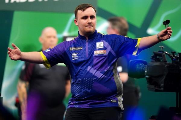 Luke Littler reacts during his match against Christian Kist (not pictured) on day six of the Paddy Power World Darts Champio<em></em>nship at Alexandra Palace, London. Picture date: Wednesday December 20, 2023. PA Photo. See PA story DARTS World. Photo credit should read: Zac Goodwin/PA Wire. RESTRICTIONS: Use subject to restrictions. Editorial use only, no commercial use without prior co<em></em>nsent from rights holder.