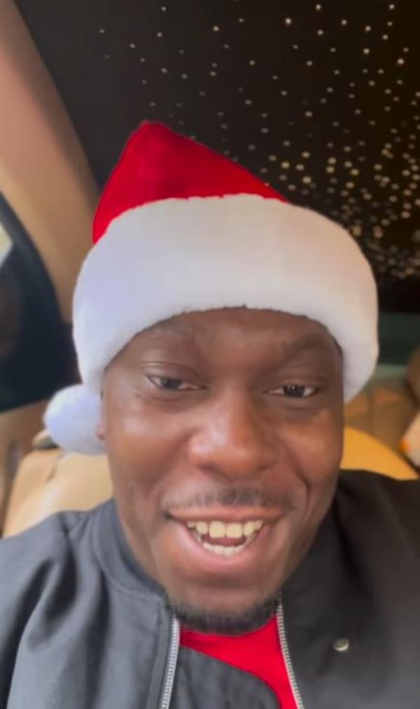 Dizzee Rascal wearing Santa hat