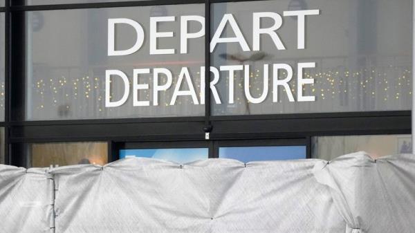 Canvas prevent to see inside the Vatry airport, Saturday, Dec. 23, 2023 in Vatry, eastern France. a<em></em>bout 300 Indian citizens heading to Central America were sequestered in a French airport for a third day Saturday because of an investigation into suspected human trafficking, authorities said. The 15 crew members of the Legend Airlines charter flight en route from United Arab Emirates to Nicaragua were questio<em></em>ned and released, according to a lawyer for the small Romania-ba<em></em>sed airline. (AP Photo/Christophe Ena)