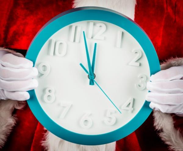 Santa holding a clock