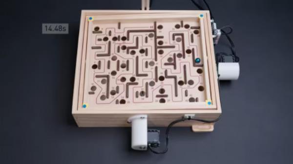 Meet CyberRunner, the robot from ETH Zurich, which mastered a physical maze game to beat humans, and pave the way for accessible AI research. (Thomas Bi/ YouTube)