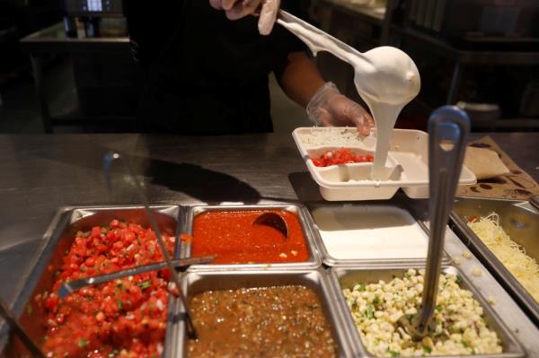 A Chipotle worker makes the new Quesadilla dish at the Chipotle Next Kitchen in Manhattan, New York, U.S., June 28, 2018.