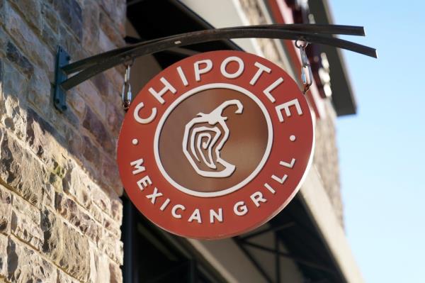 The Chipotle Mexican Grill logo hangs outside a restaurant location, Dec. 20, 2022.