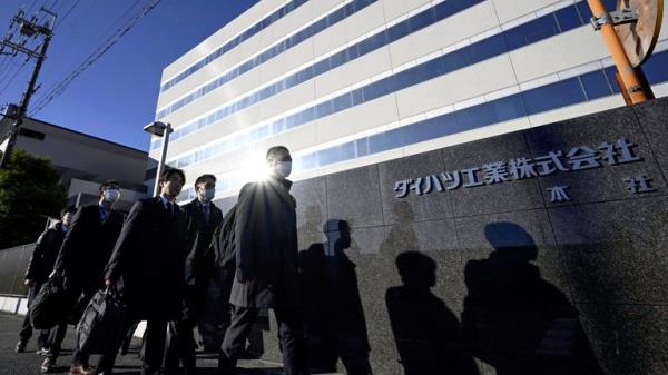 Japanese transport ministry officials arrive for the headquarters of Daihatsu Motor in Ikeda, Osaka, Thursday, Dec. 21, 2023. Japanese transport ministry officials inspected Toyota subsidiary Daihatsu on Thursday, one day after officials announced it was suspending the small car unit&#39;s shipments of all vehicles in and outside Japan after an investigation found improper testing involving 64 models.  (Kyodo News via AP)