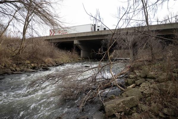 A semi-truck crosses over Salt Creek on I-94 near the location where Mishawaka resident Matthew Reun spent 6 days stranded in his crashed truck before being discovered by Portage resident Nivardo De La Torre and his father-in-law Mario Garcia. (Kyle Telechan for the Post-Tribune)