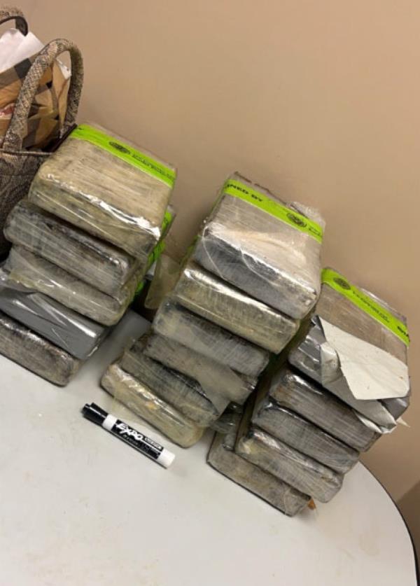 Photos from federal agents show the blocks of cocaine that were allegedly found in his bags.