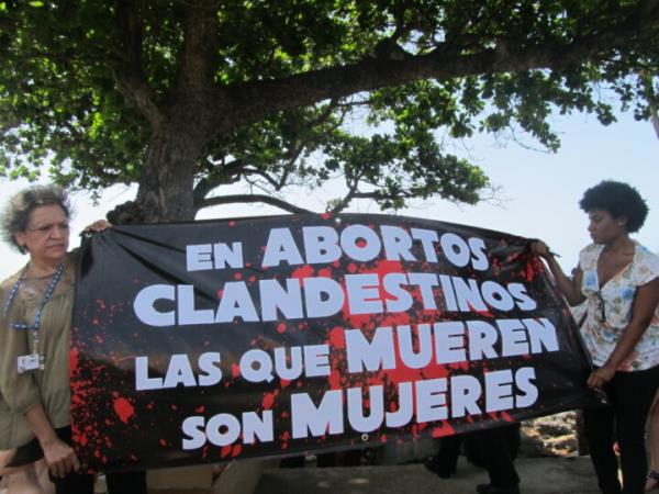 The decriminalization of abortion is one of the demands of Latin American women. In the picture, a sign warns a<em></em>bout the danger of clandestine abortions, at a demo<em></em>nstration during a meeting of the Organization of American States in the Dominican Republic, which criminalizes abortion in all circumstances, despite havin<em></em>g the highest teenage pregnancy rate in the region. CREDIT: Mariela Jara / IPS