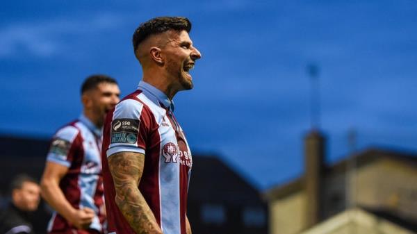 Adam Foley celebrates his goal in front of the Drogheda supporters