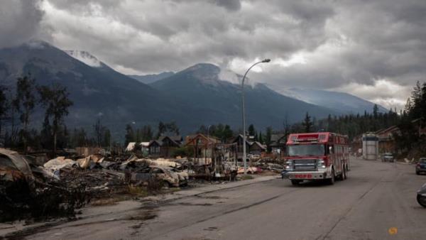 Firefighter, 24, is first victim of huge west Canada blaze