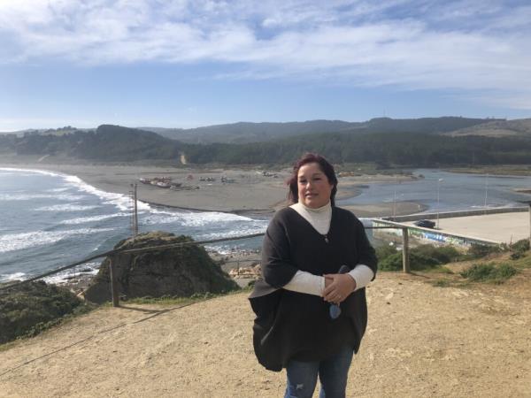 Marcela Loyola, vice-president of Agrupación de Mujeres de Mar in the coastal town of Bucalemu, at a local tourist lookout point. Credit: Orlando Milesi / IPS