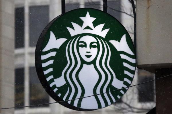 FILE - The Starbucks logo is seen on a shop, March 14, 2017, in downtown Pittsburgh. Starbucks is increasing pay and benefits for most of its U.S. hourly workers after ending its fiscal year with record sales. But the company said Monday, Nov. 6, 2023, that unio<em></em>nized workers won't be eligible for some of those perks, a sign of the co<em></em>ntinuing tension between the Seattle coffee giant and the unio<em></em>n trying to organize its U.S. stores. (AP Photo/Gene J. Puskar, File)