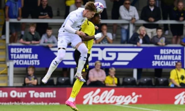 Port Vale’s Ro<em></em>nan Curtis and Nick Akoto of Burton Albion battle for the ball during a pre-season friendly.