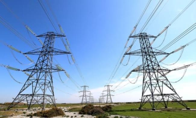 Electricity pylons in fields