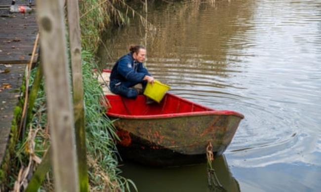 Paul Powlesland on his rowing boat on the River Roding.