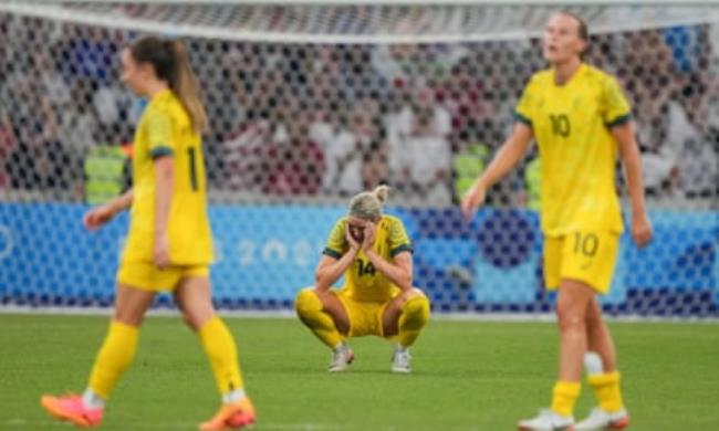 Matildas’ veteran Alanna Kennedy slumps at Stade de Marseille after Australia’s loss to USA.