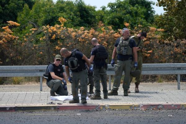 Israeli police at the site of a drone attack