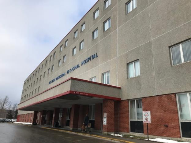 A co<em></em>ncrete and bricks building bears the words Western Memorial Regio<em></em>nal Hospital in blue lettering. 