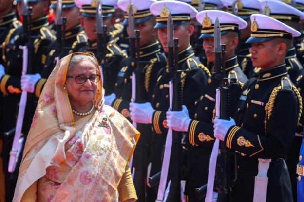 Bangladeshi Prime Minister Sheikh Hasina reviews an ho<em></em>nour guard. 