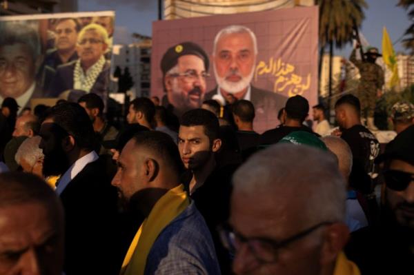 Supporters of Hamas and Hezbollah take part in a protest co<em></em>ndemning the killing of Hamas leader Ismail Haniyeh and Hezbollah top commander Fuad Shukr, in Sidon, Lebanon.