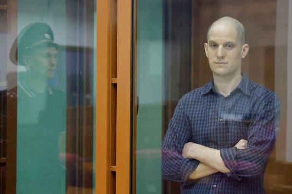 Wall Street Journal reporter Evan Gershkovich, who stands trial on spying charges, is seen inside an enclosure for defendants before a court hearing in Yekaterinburg, Russia June 26