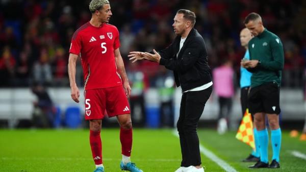 Wales manager Craig Bellamy speaks to Ethan Ampadu