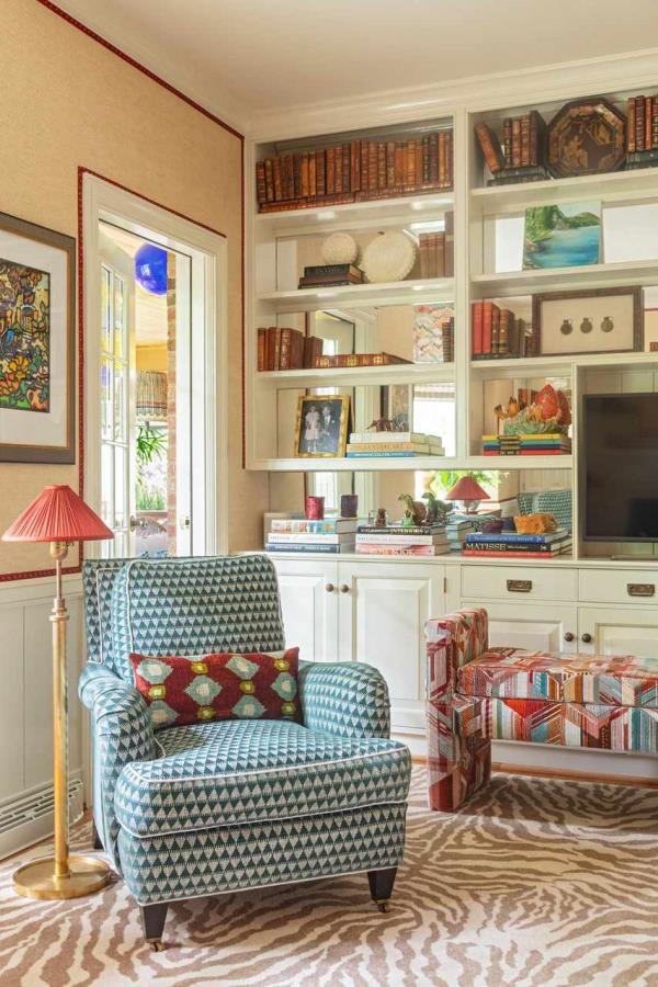 reading nook next to open shelving with books