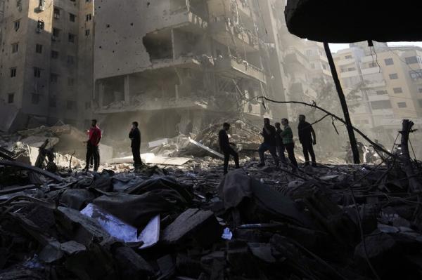 People check the site of the assassination of Hezbollah leader Hassan Nasrallah in Beirut's southern suburbs, Sunday, September 29, 2024. 