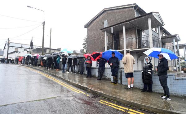 The queue to order food at Jackie Lennox's during the Orange weather warning on Saturday afternoon. The chip shop had its last day of business on Sunday. Picture: Larry Cummins