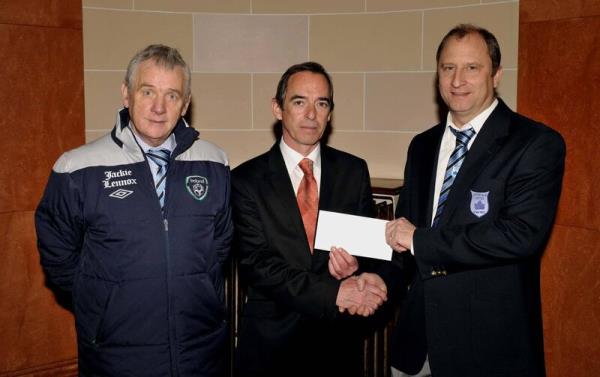 Brian Lennox (right) of Jackie Lennox's takeaway presenting a cheque to Avo<em></em>ndale United chairman Kevin Daly (centre) to help with the cost of expenses for their FAI Intermediate Cup semi-final with Tolka Rovers in 2013. Picture: Mick English