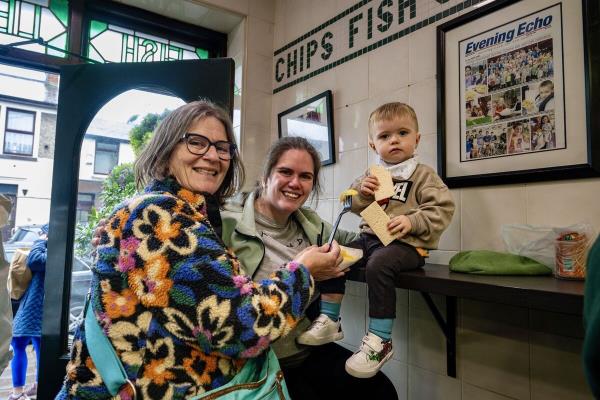 Three generations of Noo<em></em>nan family, Geraldine, Megan and Daniel, 3, pictured making bittersweet memories in Jackie Lennox’s chip shop wher<em></em>e Daniel tasted his first and last Lennox chip on Friday. Picture Chani Anderson