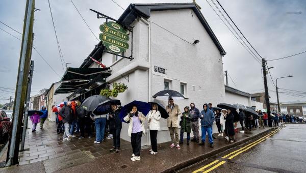 There was more than pies and battered sausages being served in Jackie Lennox’s chip shop on Friday as hugs, handshakes and lashings of nostalgia was also on until menu for the hundred of loyal customers who queued in the rain for their last supper. Picture Chani Anderson