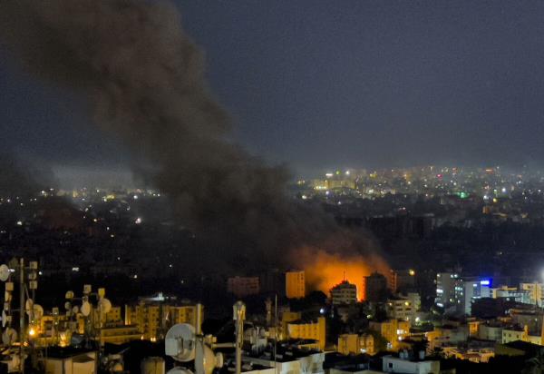 Flames and smoke rise from Israeli airstrikes in Dahiyeh, Beirut, Lebanon, Friday, Oct. 4, 2024. (AP Photo/Hussein Malla)