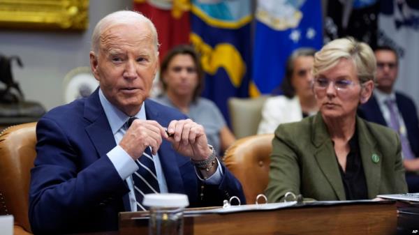 President Joe Biden delivers remarks on the federal government's respo<em></em>nse to Hurricane Helene and preparations for Hurricane Milton in the Roosevelt Room of the White House, Oct. 8, 2024, as Secretary of Energy Jennifer Granholm looks on.