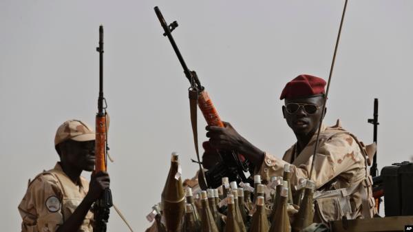 FILE - Sudanese soldiers from the Rapid Support Forces unit, led by Gen. Mohammed Hamdan Dagalo, the deputy head of the military council, secure the area wher<em></em>e Dagalo attends a military-backed tribe's rally, in the East Nile province, Sudan, June 22, 2019. 