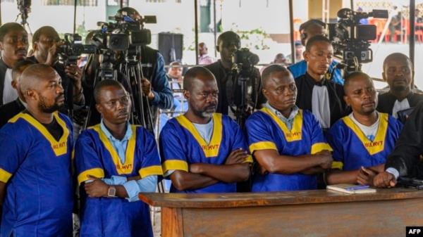 FILE - Defendants accused of belo<em></em>nging to the M23 rebel group look on while at the Ndolo prison in Kinshasa, Democratic Republic of the Congo, during their sentencing on Aug. 8, 2024.