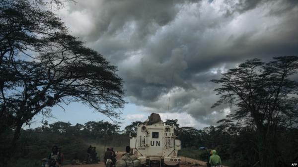 FILE - A UN vehicle drives along a road, in Beni territory, North Kivu province, eastern Democratic Republic of Congo, on May 9, 2024. 