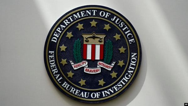 FILE - An FBI seal is displayed on a wall in Omaha, Nebraska, Aug. 10, 2022.