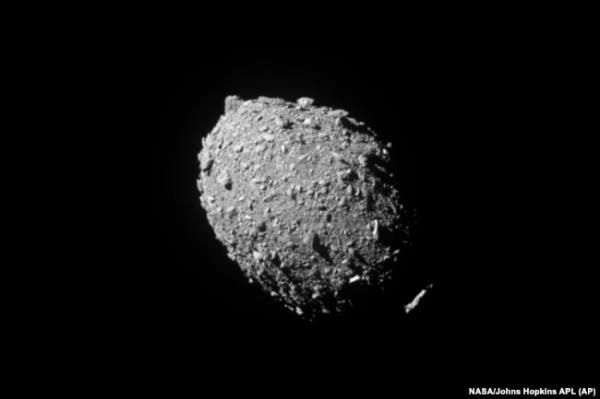 FILE - This image provided by NASA shows the asteroid Dimorphos, captured by NASA’s DART mission just two seco<em></em>nds before the spacecraft struck its surface, Sept. 26, 2022.