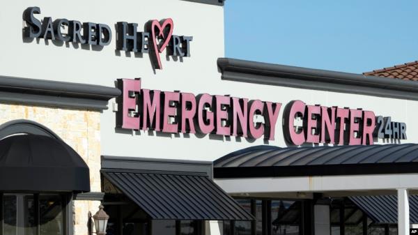 FILE - Signage for the Sacred Heart Emergency Center is seen in Houston, Texas, March 29, 2024.