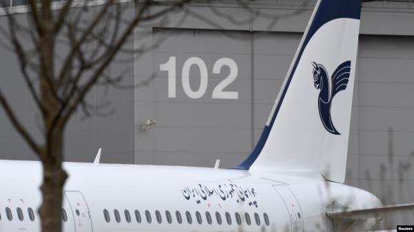 FILE - An Airbus with the des<em></em>cription "The Airline of the Islamic Republic of Iran" is parked at the Airbus facility in Hamburg Finkenwerder, Dec. 19, 2016. Iran 's aviation body announced Sunday the cancelation of flights at some of the country's airports. 