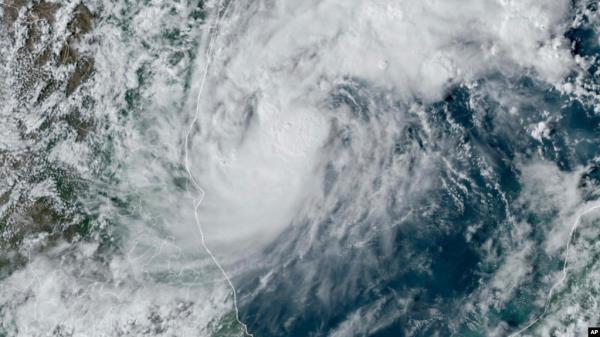 This GOES-16 GeoColor satellite image taken at 4:50 p.m. EDT and provided by Natio<em></em>nal Oceanic and Atmospheric Administration (NOAA) shows Tropical Storm Milton, center, off the coast of Mexico in the Gulf of Mexico, Oct. 5, 2024.