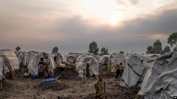 FILE - People displaced by the o<em></em>ngoing fighting gather at refugee camp on the outskirts of Goma, Democratic Republic of the Congo, July 11, 2024.