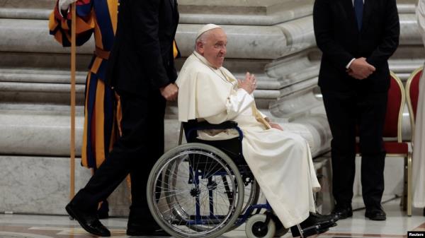 Pope Francis sits in a wheelchair as he leaves after presiding over a vigil, ahead of the Synod of bishops, at Saint Peter's church at the Vatican, Oct. 1, 2024. 