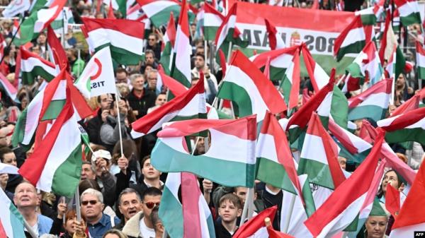 Supporters of the opposition 'TISZA' party protest against what they call "government propaganda" at the main state MTVA channel headquarters in Budapest, Hungary, Oct. 5, 2024.