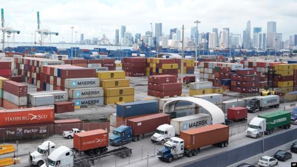 Trucks line up to enter Port Miami after the unio<em></em>n representing 45,000 striking U.S. dockworkers reached a deal to suspend a three-day strike, Oct. 4, 2024, in Miami. 