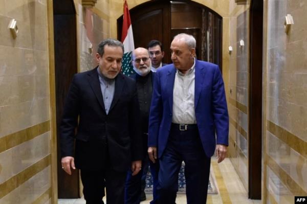 Iranian Foreign Minister Abbas Araghchi, left, and Lebanon's Parliament Speaker Nabih Berri leave after their meeting in Beirut, Oct. 4, 2024. Araghchi vowed support for Tehran's 